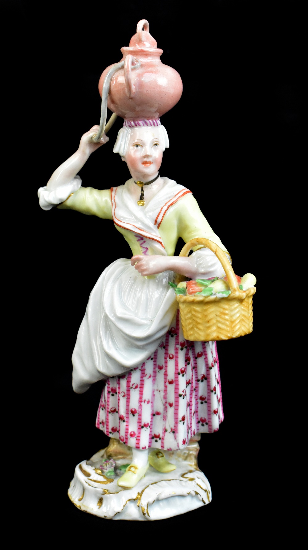 MEISSEN; a mid-18th century figure of an egg seller modelled by Reincike and designed by Christopher