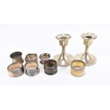 S BLANCKENSEE & SON LTD; a pair of George V hallmarked silver candlesticks of squat plain form,