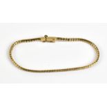 A 9ct yellow gold textured flat link bracelet, length 19cm, approx 7.9g.Additional