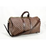 LOUIS VUITTON; a Keepall Bandouliere 55 Monogram macassar Boston bag, with brown leather straps