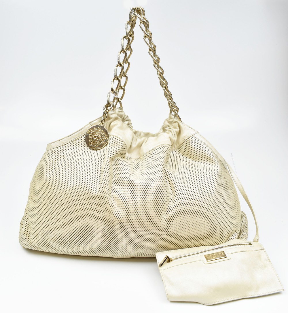 VERSACE; a cream Napa leather shoulder bag with gold-tone metal chain handle and Versace logo