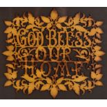 A fretwork panel, 'God Bless Our Home', framed and glazed, overall 41 x 45cm.Additional