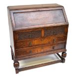 An early 20th century oak bureau on stretchered supports. Additional InformationHeight 102cm,