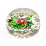 BACCARAT; a 'Pom Pom Garland' paperweight, with star cut base, diameter 6cm.Additional