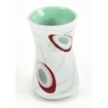 JOHN DITCHFIELD; an art glass vase with cased light blue body featuring trailed and stylised detail,