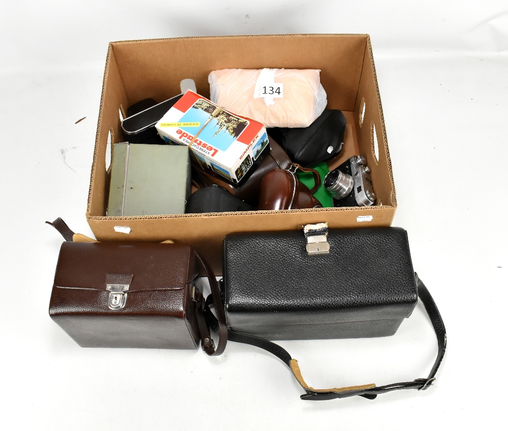 A quantity of various camera accessories including cases, a FED camera, Concord camera, etc.