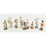 A collection of nine late 19th century and later ceramic figurines and two scent bottles, comprising