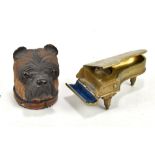A circa 1900 novelty inkwell carved as a dog's head with spring hinged cover and internal