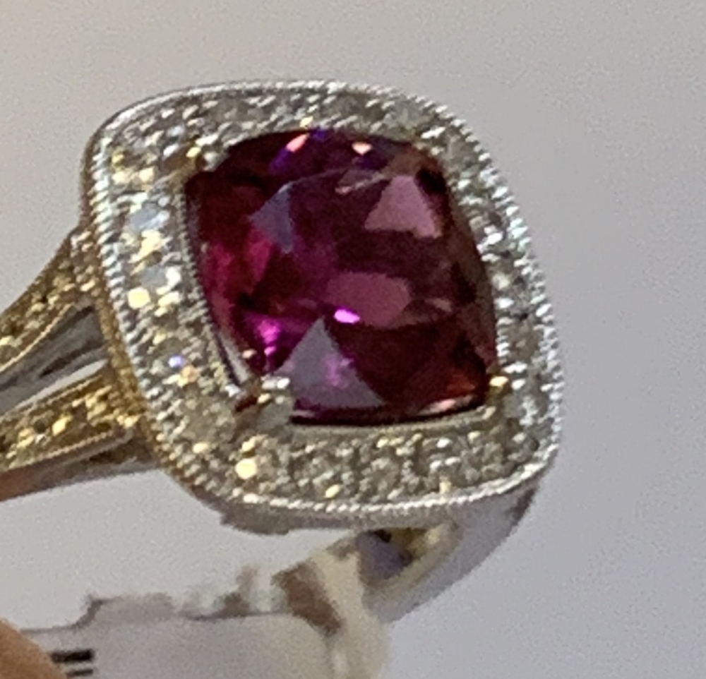 An 18ct white gold diamond and rubellite ring with pierced shoulders and raised platforms, size N, - Image 4 of 4