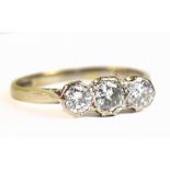 An 18ct white gold and diamond three stone ring, the diamonds totalling approx 0.68ct, size Q,