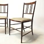 COLLINSON & LOCK; a pair of Aesthetic Movement rosewood spindle back chairs, impressed marks and