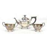 WILLIAM AITKEN; a George V hallmarked silver three piece tea service with engraved ribbon and floral