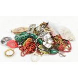 A mixed group of costume jewellery including bead necklaces, brooches, etc.Additional