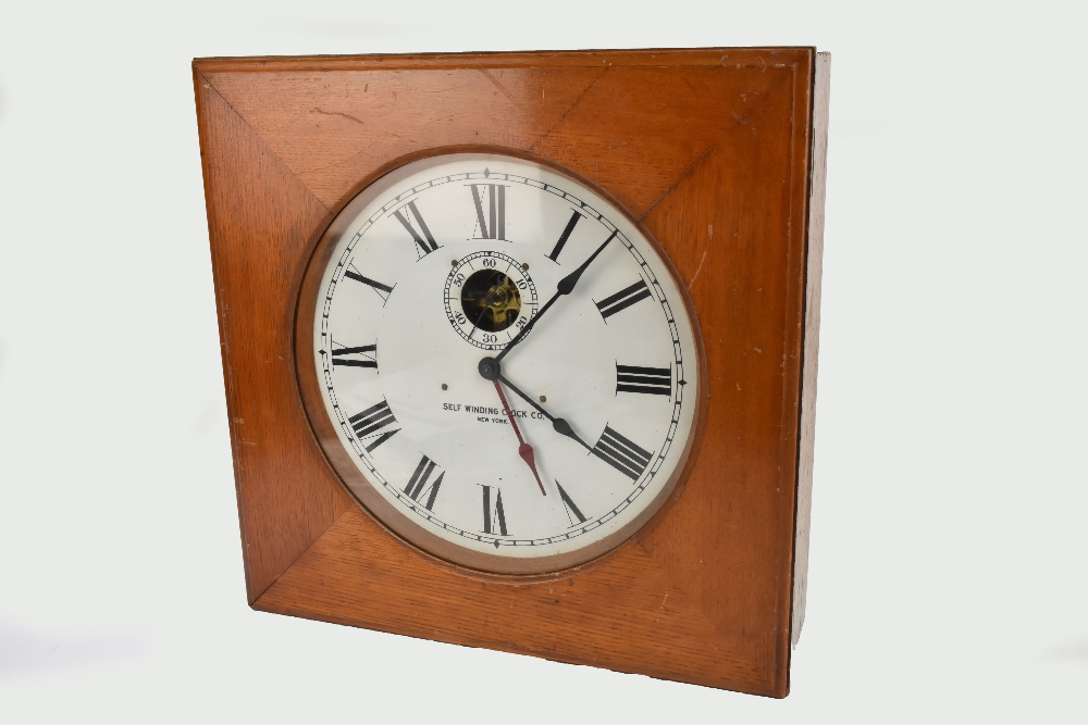 SELF WINDING CLOCK CO OF NEW YORK; an early 20th century wall mounted self winding clock, the