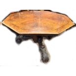 A mid Victorian figured walnut octagonal centre table with ebony stringing on substantial central