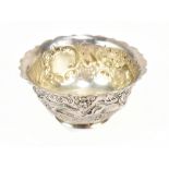 WEST & SON; a Victorian Irish hallmarked silver footed bowl, with repousse and cast decoration