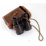 A pair of vintage Iris De Paris sporting binoculars in military leather binocular case stamped 3441