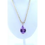 A 9ct gold pendant set with large amethyst and 9ct gold rope twist chain.