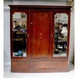 An Edwardian mahogany inlaid triple wardrobe,