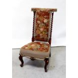 A 19th century mahogany barleytwist prie-dieu/prayer chair raised on cabriole supports and hoof