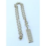 A 9ct gold ingot suspended on a 9ct gold chain link necklace, length of chain approx.