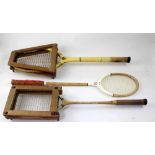 A quantity of vintage tennis rackets.