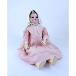 A German bisque headed doll, stamped 'DCP Germany HANDWERCK 3' with composite joints,