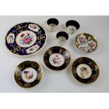 Two pairs of Regency hand painted coffee cups and saucers with floral decoration within printed