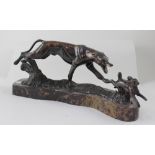 A bronze model of a hound chasing a hare, on a marble base, unsigned, 44 x 17cm.