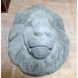 A reconstituted stone wall-hanging lion mask, height 38cm.