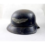 A WWII German Luftschutz helmet with complete decal.