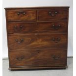 A George III mahogany chest of two short and three long graduated drawers, with brass swing handles,