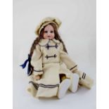 An Armand Marseille Germany AM5DEP bisque head doll with sleepy eyes and open mouth,