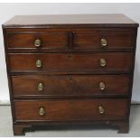 A George III mahogany chest of two short and three long drawers, with later brass handles,