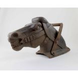 A cast iron Wicksteed playground hobby horse head, height 30cm, length 52cm.