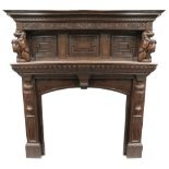 A late 19th/early 20th century large and impressive oak fire surround and mantel,