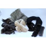 A quantity of various fur stoles, scarves and a short coat.