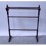 An Edwardian walnut towel rail on turned supports and outswept feet, height 90cm.