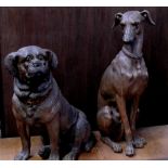 A terracotta model of a seated whippet and another of a seated hound, both with amber glass eyes,