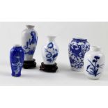 Five 20th century miniature Chinese vases, two with wooden stands (5).