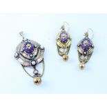 A Victorian yellow metal pendant set with pearls and central amethyst and a matching pair of