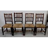 A set of four country-style kitchen chairs with bobbin-turned backs, rush seats,