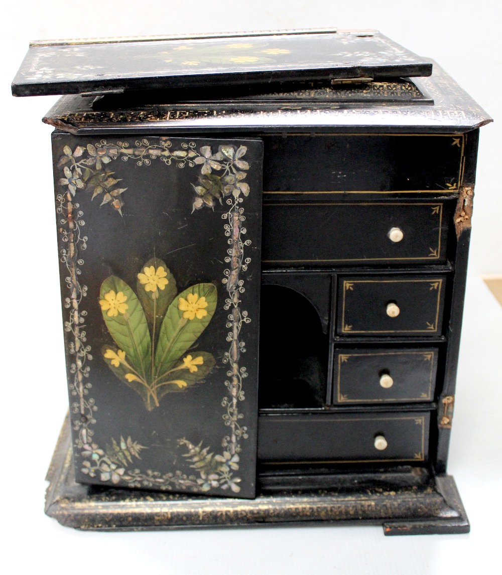 A Japanese Kodansu lacquer cabinet painted with flowers with inlaid mother of pearl borders,