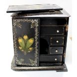 A Japanese Kodansu lacquer cabinet painted with flowers with inlaid mother of pearl borders,