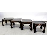 A late 19th/early 20th century black lacquered nest of tables with Oriental design,