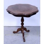 A reproduction Italian serpentine-top occasional table on turned baluster support with cabriole