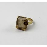A 9ct gold dress ring set with a large square cut smoky quartz, size I, approx 2.5g.