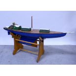 A remote controlled scratch-built wooden model of a yacht, single mast, parquetry inlaid decking,