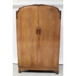 An Art Deco oak three-piece bedroom suite comprising wardrobe,