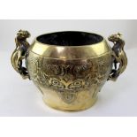 A Chinese brass or polished bronze planter with twin Chilong handles and Taotie masks to either